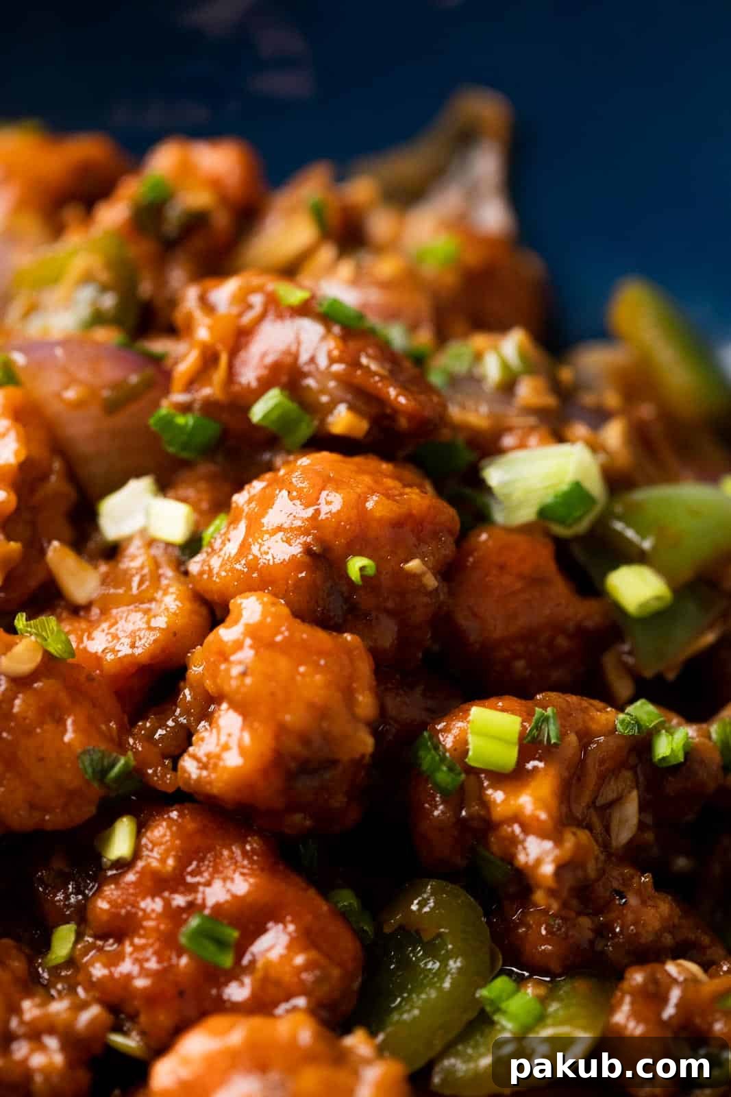 Easy Crispy Gobi Manchurian 6 A close-up shot of crispy Gobi Manchurian, highlighting the perfectly coated cauliflower florets and vibrant sauce.