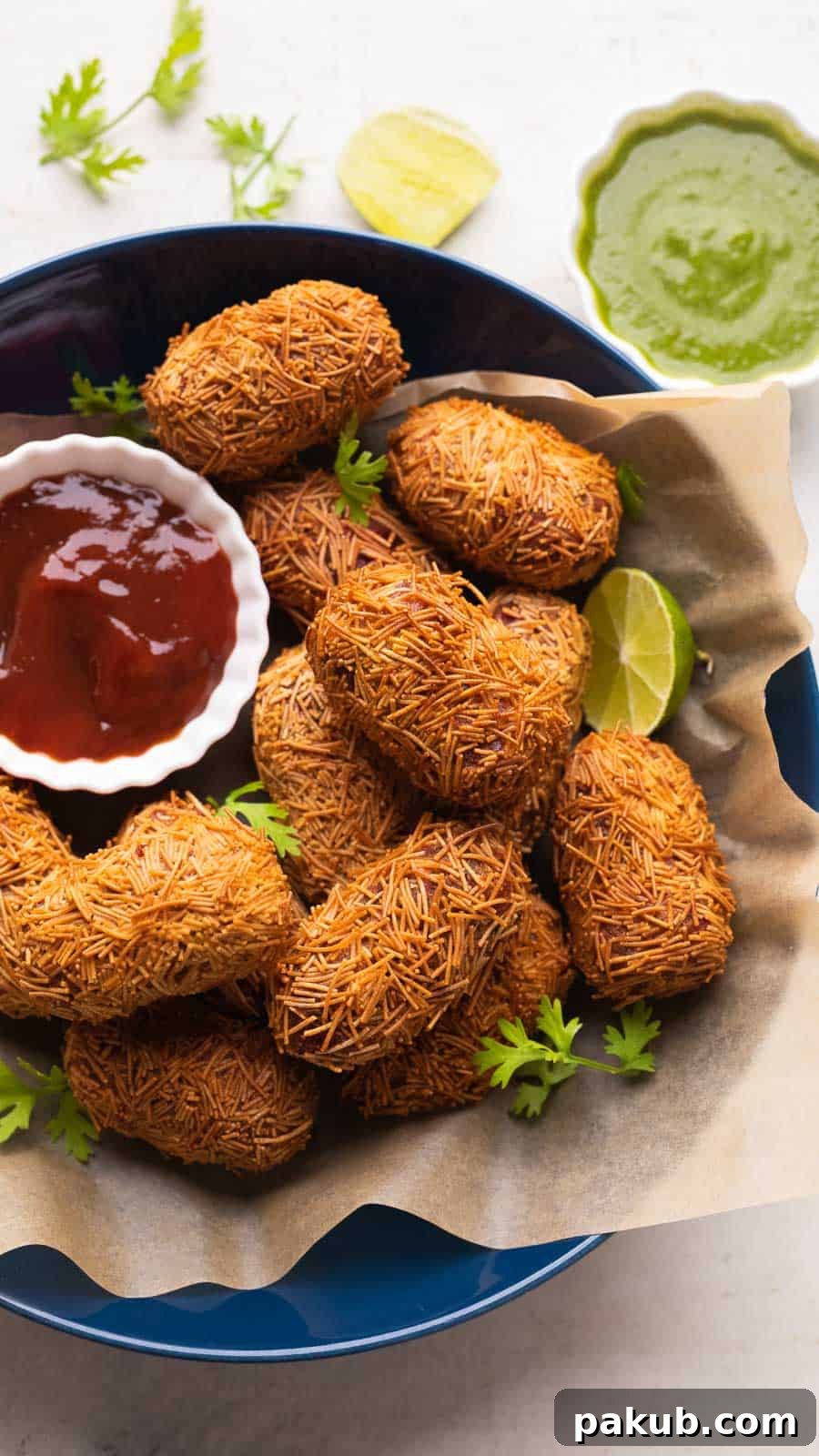 Vibrant Beetroot Potato Croquettes 2 Veg Cutlets served in a blue bowl with green chutney and ketchup