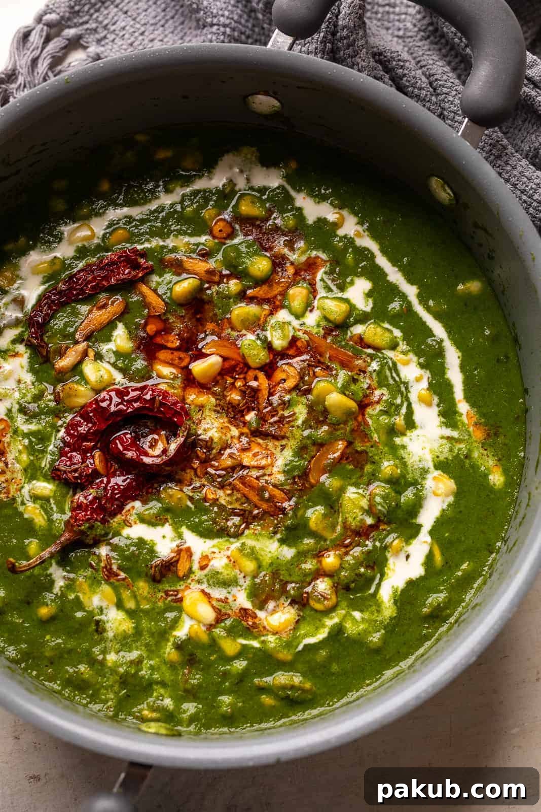 Garlicky Corn Spinach 2 Corn palak served in a beautiful dish, showcasing its creamy texture and garlicky tadka