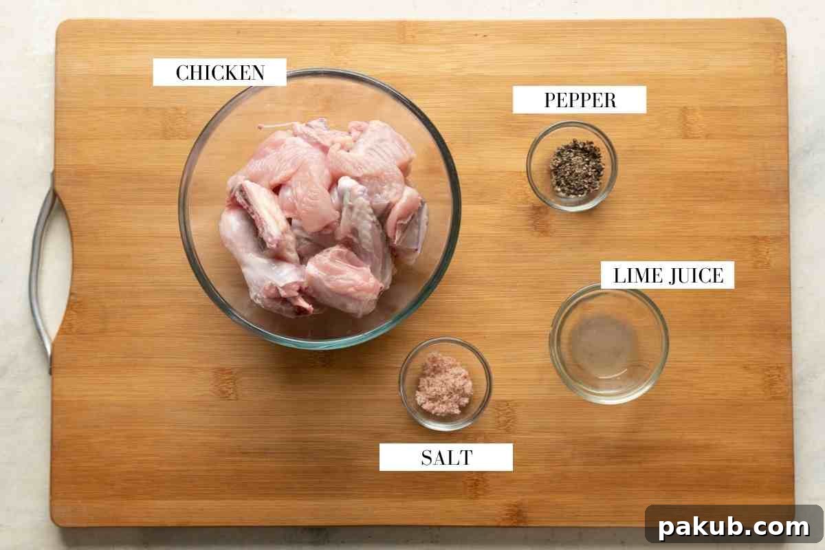 Ingredients for marinating chicken kali mirch on a brown board with text to identify them