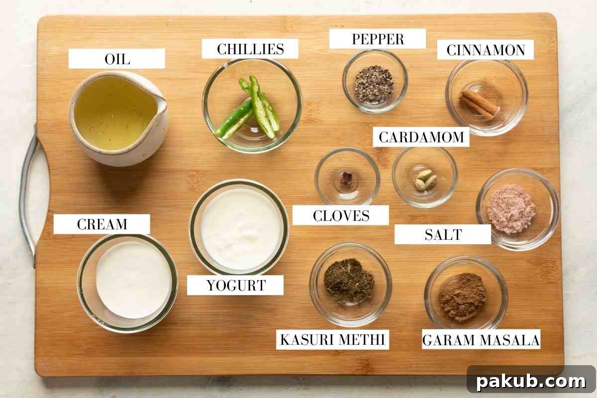 Ingredients for making the gravy for chicken kali mirch on a brown board with text to identify them