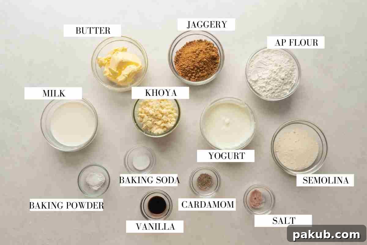 Ingredients for mawa cake laid out on a white table with text to identify them