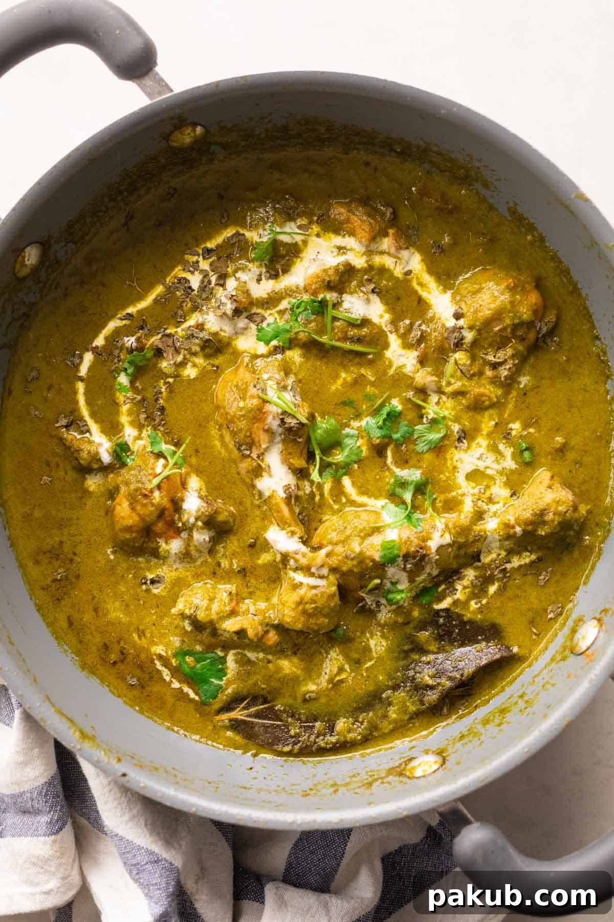 Saag Palak Chicken Recipe 8 A close-up shot of freshly cooked Saag Chicken (Palak Chicken) simmering in the pan, highlighting its rich texture and vibrant green color.