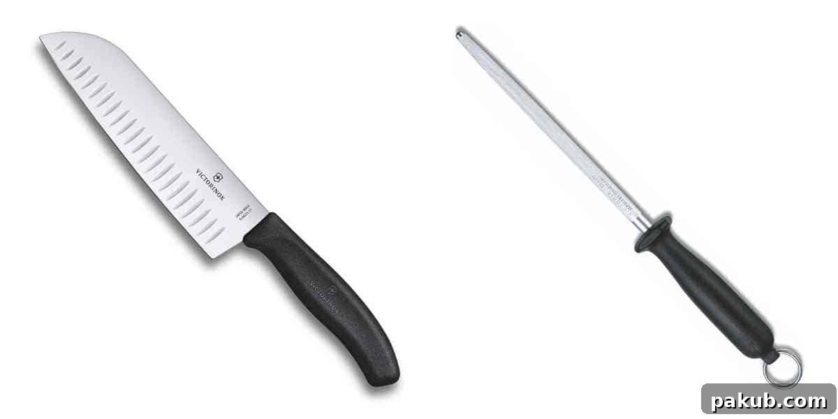 My Favorite Kitchen Workhorses of 2022 3 The Victorinox Santoku knife, a versatile kitchen essential, resting beside its accompanying sharpening rod, highlighting their importance for maintaining a sharp edge and efficient food preparation.