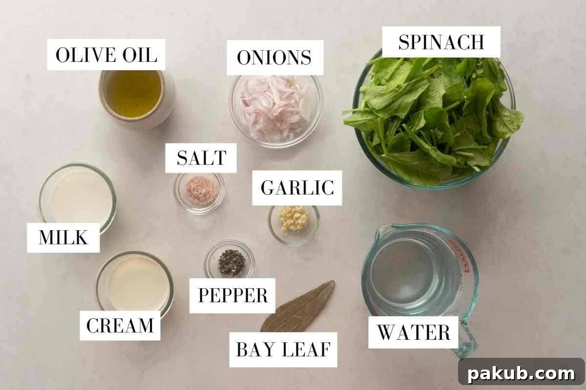 Velvety Spinach Delight 3 A flat lay photograph showcasing all the fresh ingredients needed for homemade spinach soup, neatly arranged and labeled on a rustic wooden surface.