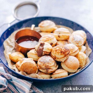Delicious chocolate stuffed mini pancake bites, served with a side of golden maple syrup.