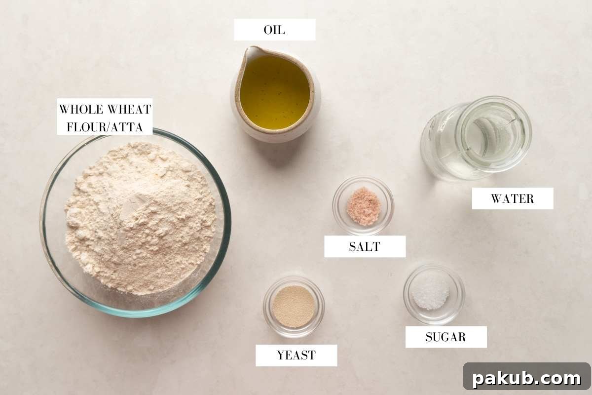 Simple Wholesome Whole Wheat Pita 3 Picture of all the ingredients required for whole wheat pita bread with text to identify them
