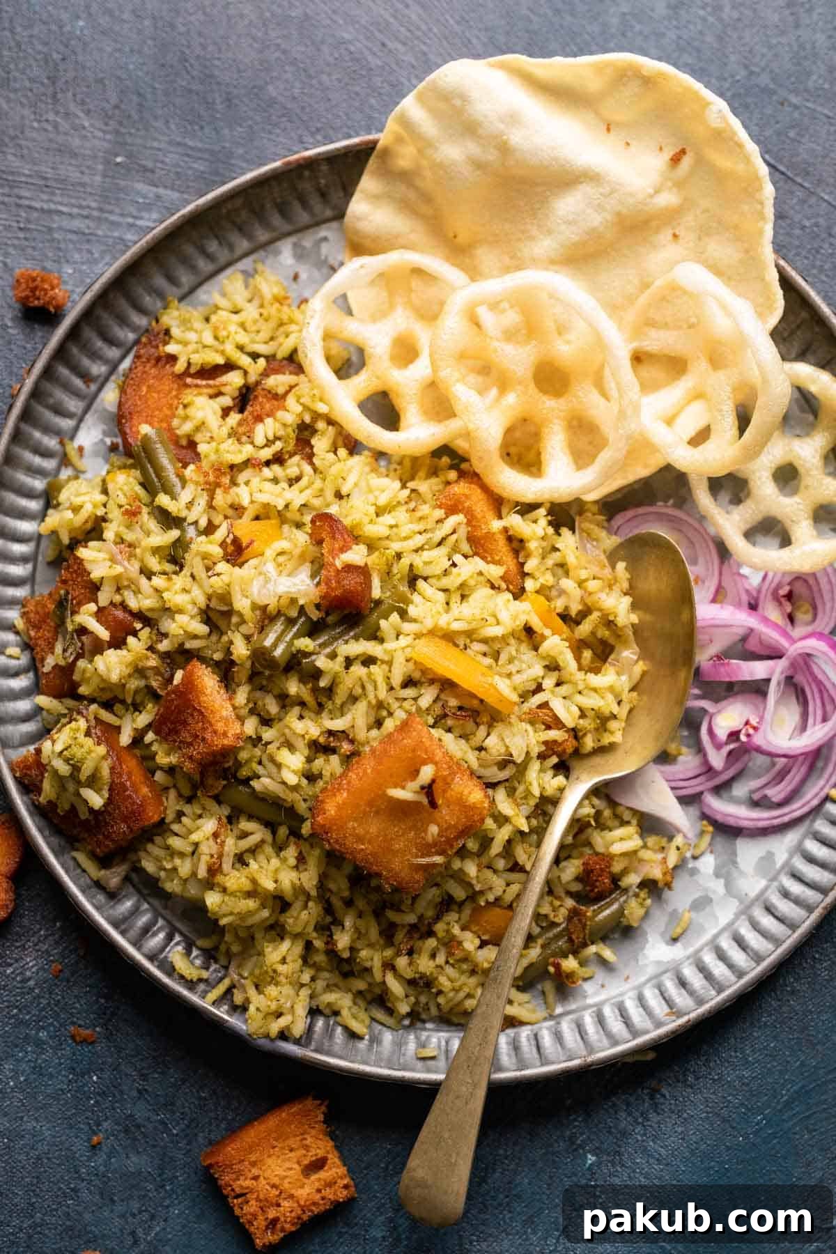 Kavitha Auntys Aromatic Rice Delight 2 Flavorful Karnataka Rice Bath served with crispy sides and fresh onions
