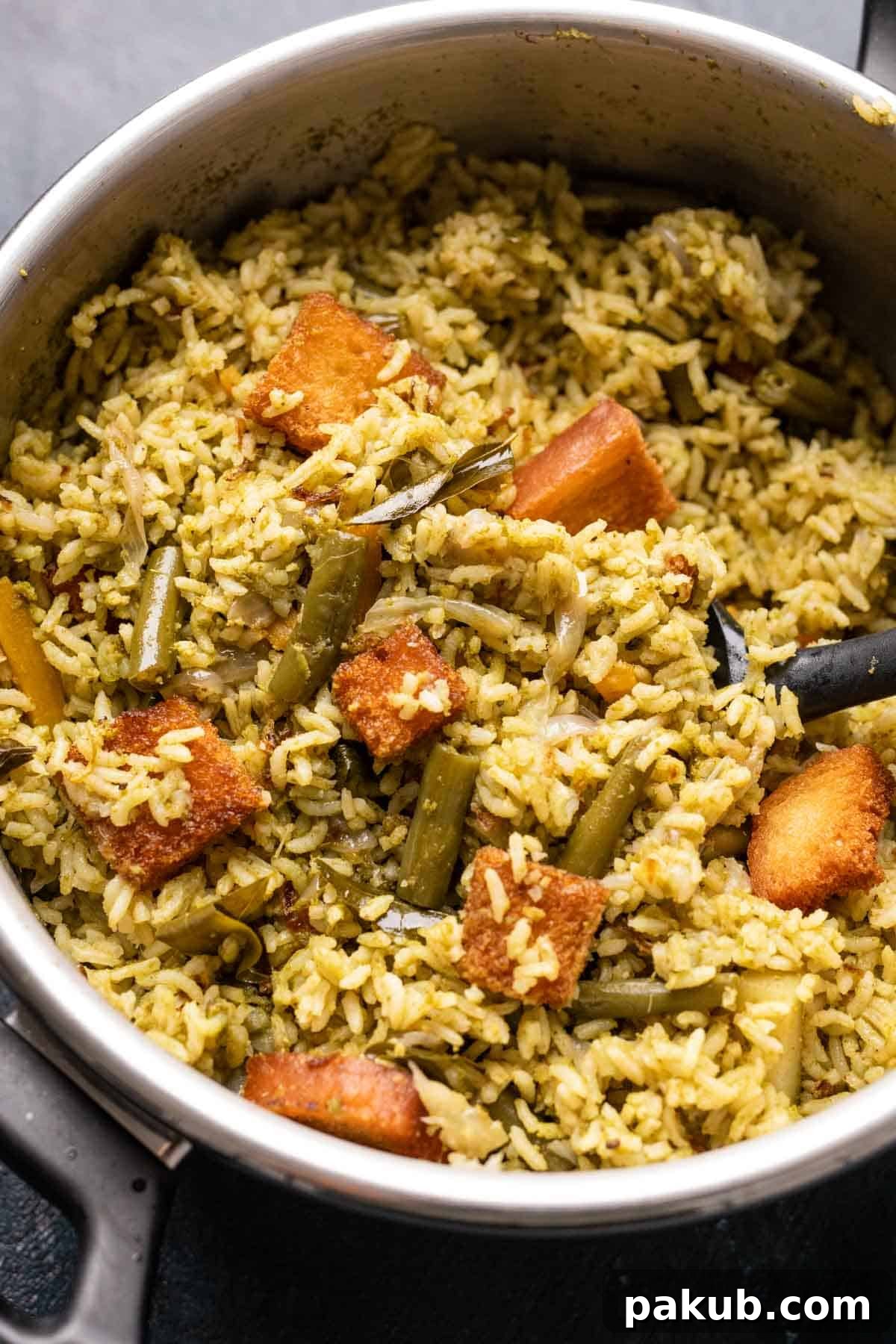 Kavitha Auntys Aromatic Rice Delight 5 Karnataka Rice Bath served hot from a pressure cooker, garnished with lemon, croutons, and fried onions