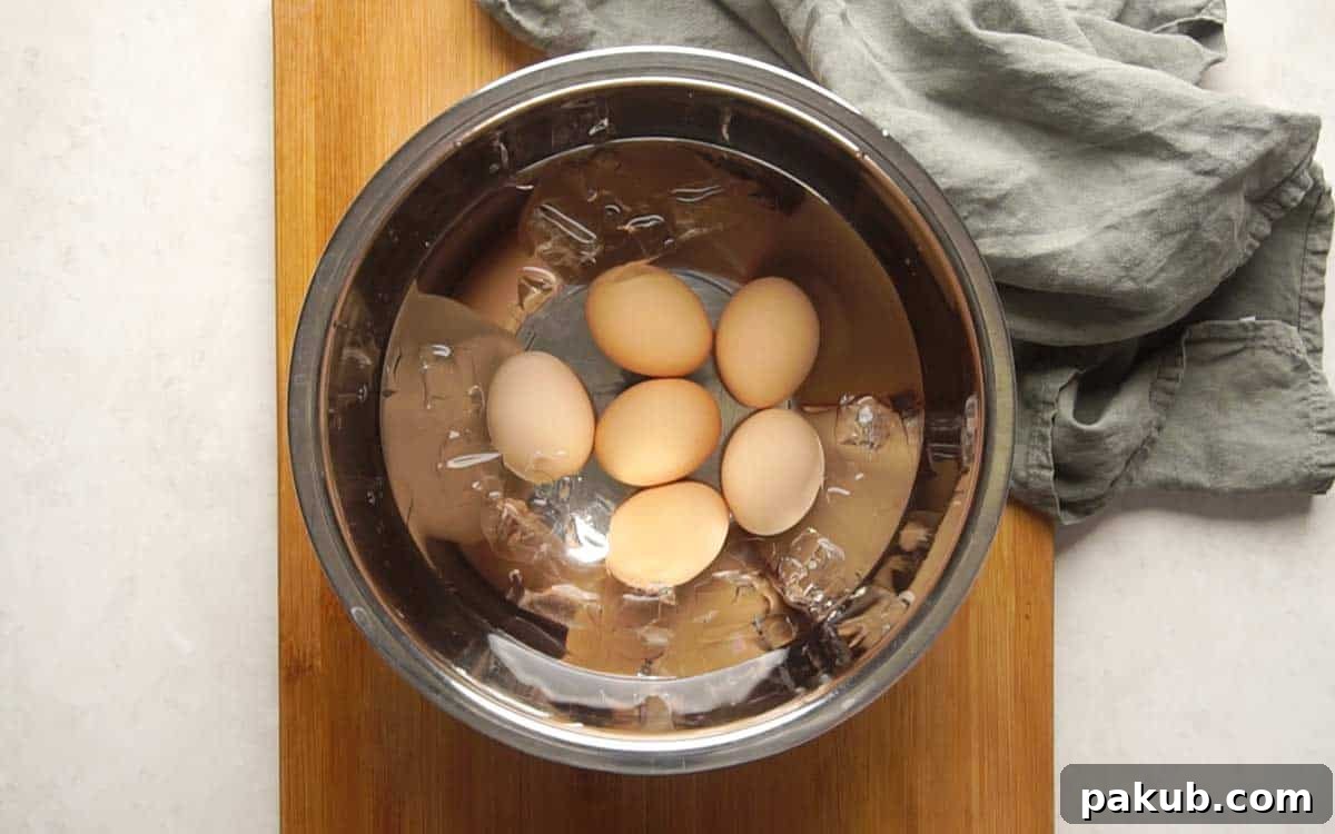Perfect Hard Boiled Eggs Every Time 6 Picture showing how to make hard boiled eggs - Transferring to ice bath