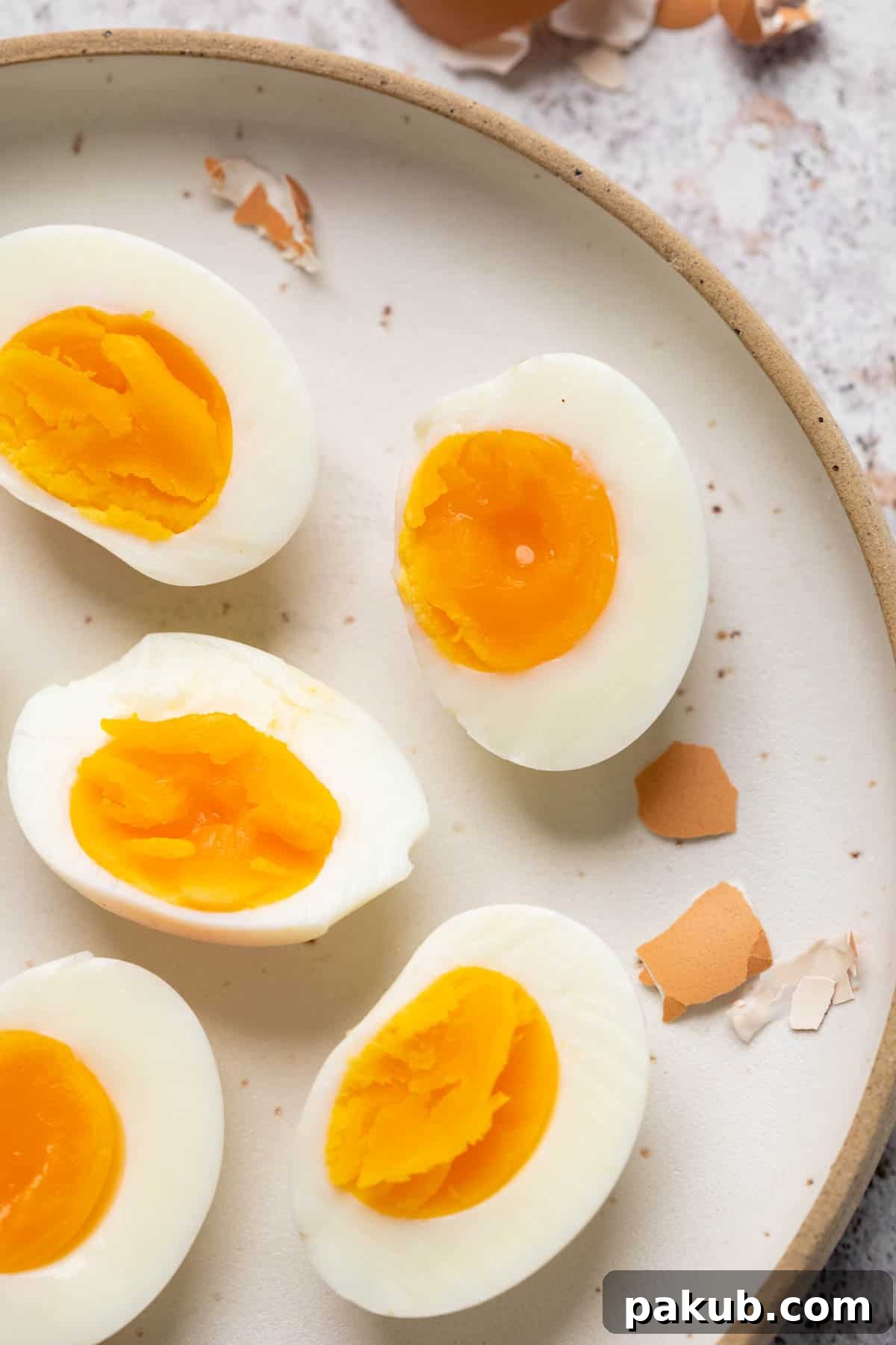 Perfect Hard Boiled Eggs Every Time 8 Different varieties of hard boiled eggs placed on a white plate