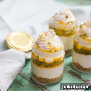 Individual cheesecake jars, showcasing their portable and beautiful presentation, perfect for parties or on-the-go enjoyment.
