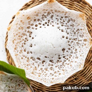 Tender coconut appam in a wicker basket, ready to be served