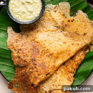 Instant oats dosas served on banana leaf-lined plates with coconut chutney, looking healthy and inviting
