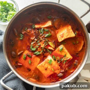 Soondubu jjigae, a Korean soft tofu stew, served steaming hot in the traditional cooking pot.