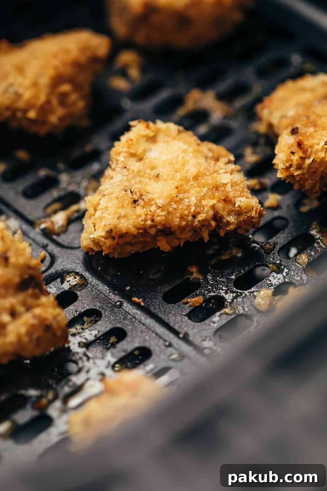 Mastering Air Fryer Cooking From Basics to Delicious Recipes 5 Closeup of Air Fryer Chicken Nugget in the basket