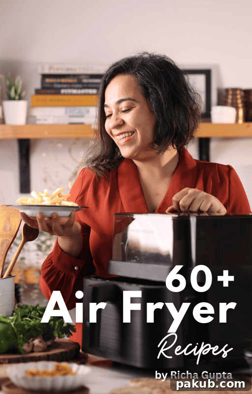 Crispy Air Fryer Okra 3 A smiling woman holds a plate of air-fried food next to an air fryer, promoting a cookbook.