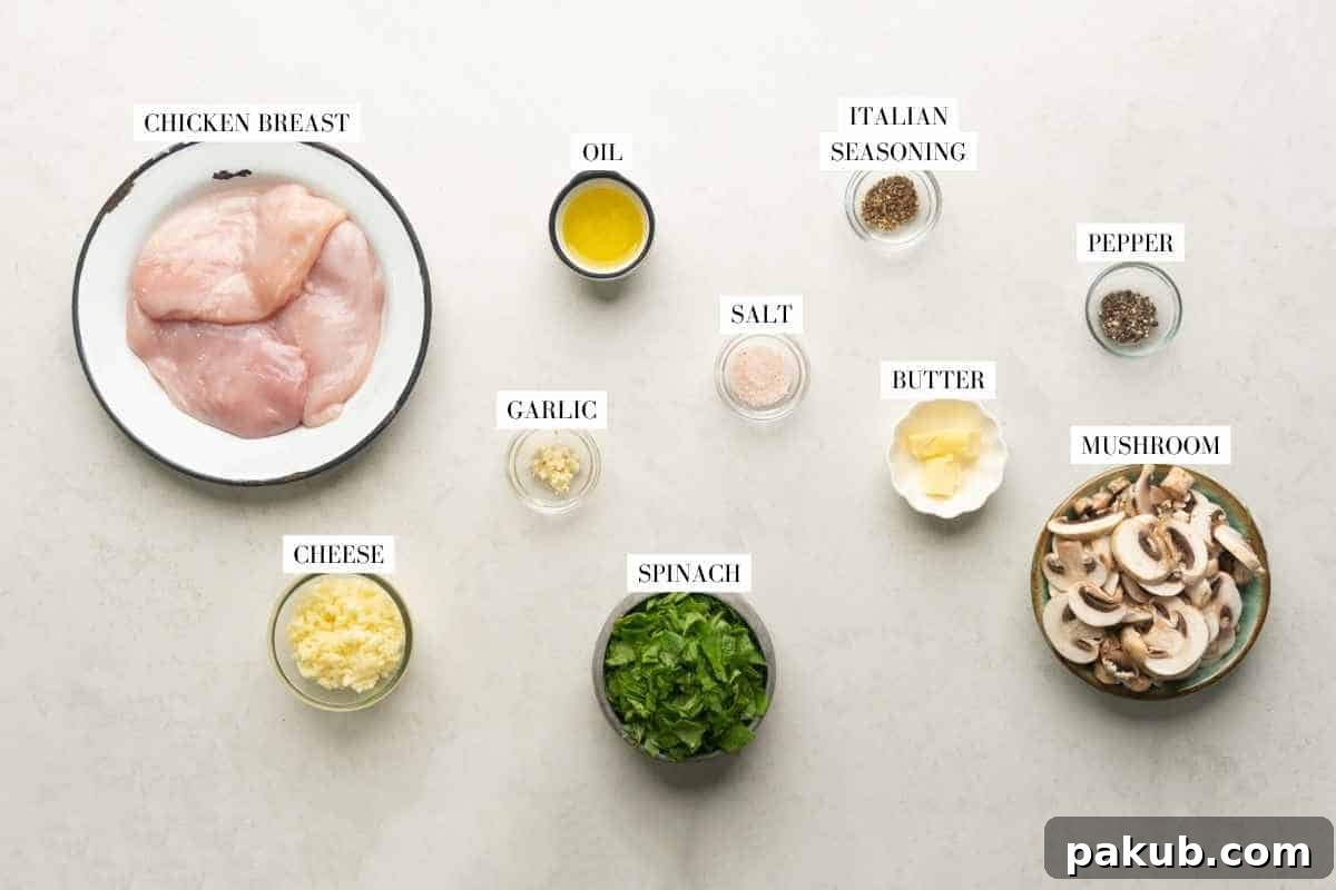 Golden Air Fryer Stuffed Chicken Breasts 4 A flat lay of fresh ingredients for stuffed chicken breast including chicken, spinach, mushrooms, cheese, garlic, and Italian seasoning.