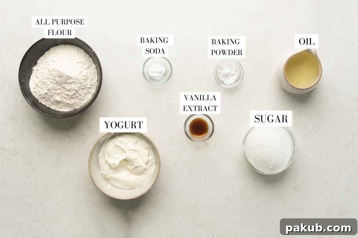 Effortless Air Fryer Vanilla Sponge Perfectly Egg-Free 4 A visual overview of all 7 key ingredients for the air fryer eggless vanilla cake, neatly arranged with labels for easy identification.