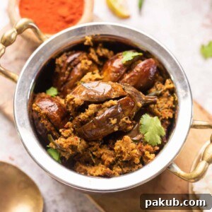 Picture of air fryer stuffed baingan served in a steel bowl
