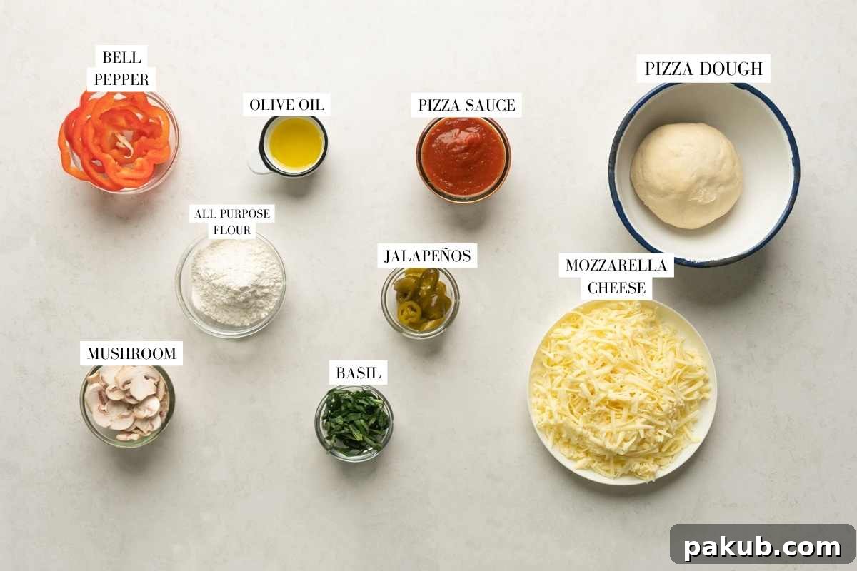 Quick Yeast-Free Air Fryer Pizza 3 A vibrant flat lay image showcasing all the fresh ingredients required for preparing an air fryer baked pizza, including dough, bell peppers, mushrooms, and cheese.