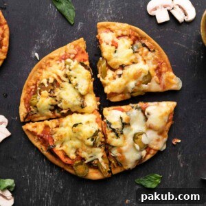 Quick Yeast-Free Air Fryer Pizza 7 Crispy no-yeast pizza cooked in an air fryer, with melted cheese and fresh basil