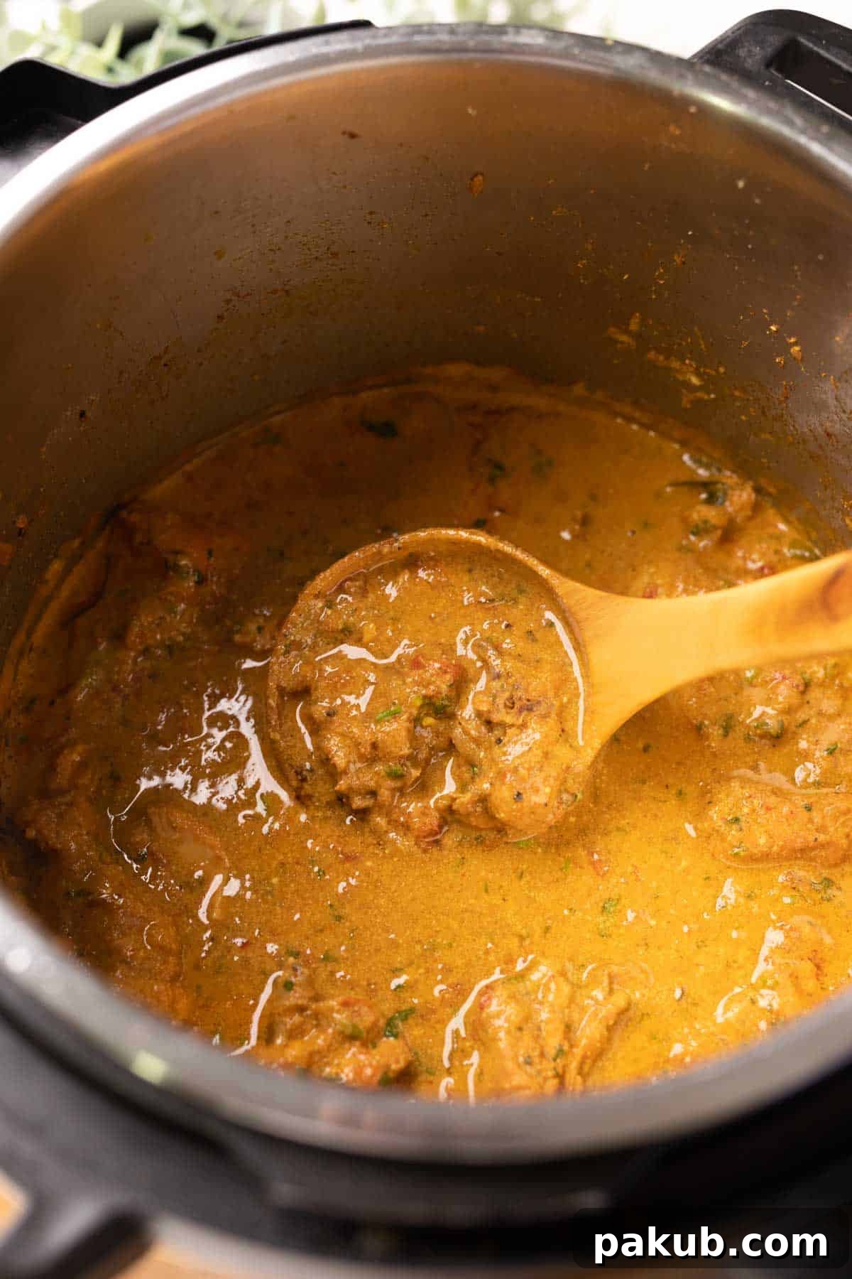Creamy Instant Pot Coconut Chicken Curry 6 A close-up shot of the rich, creamy Instant Pot Coconut Chicken Curry simmering inside the Instant Pot, ready to be served.