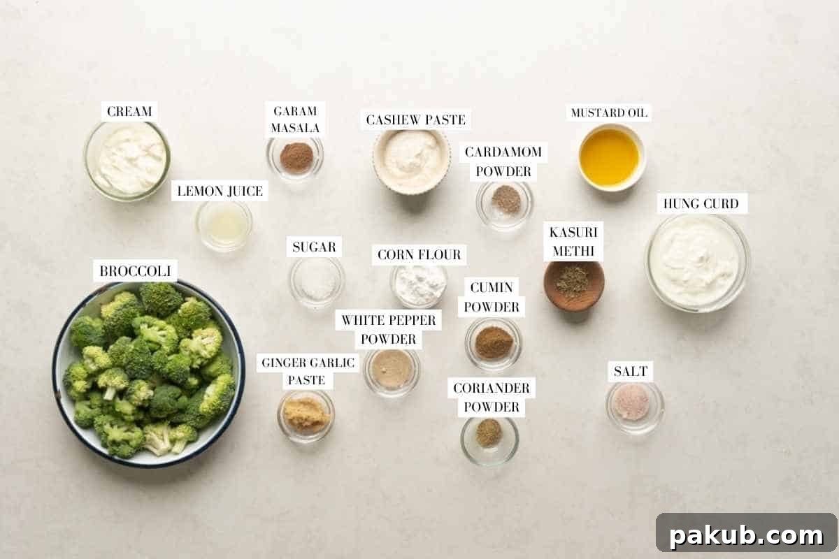 Air-Fried Malai Broccoli 4 A beautifully arranged flat lay photograph displaying all the fresh ingredients required to make Malai Broccoli, with clear labels for each item.