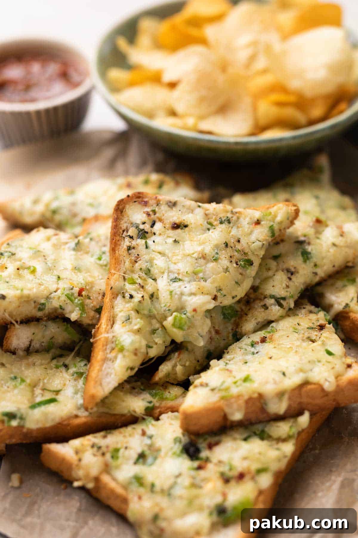 Fiery Cheese Garlic Bread 5 Freshly cooked Chilli Cheese Garlic Toasts, golden brown with perfectly melted cheese, garnished with herbs, and served on a elegant dark platter.