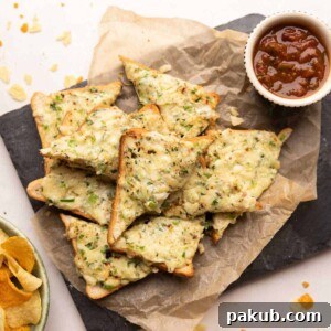 Chilli cheese garlic toasts straight from the pan on a platter