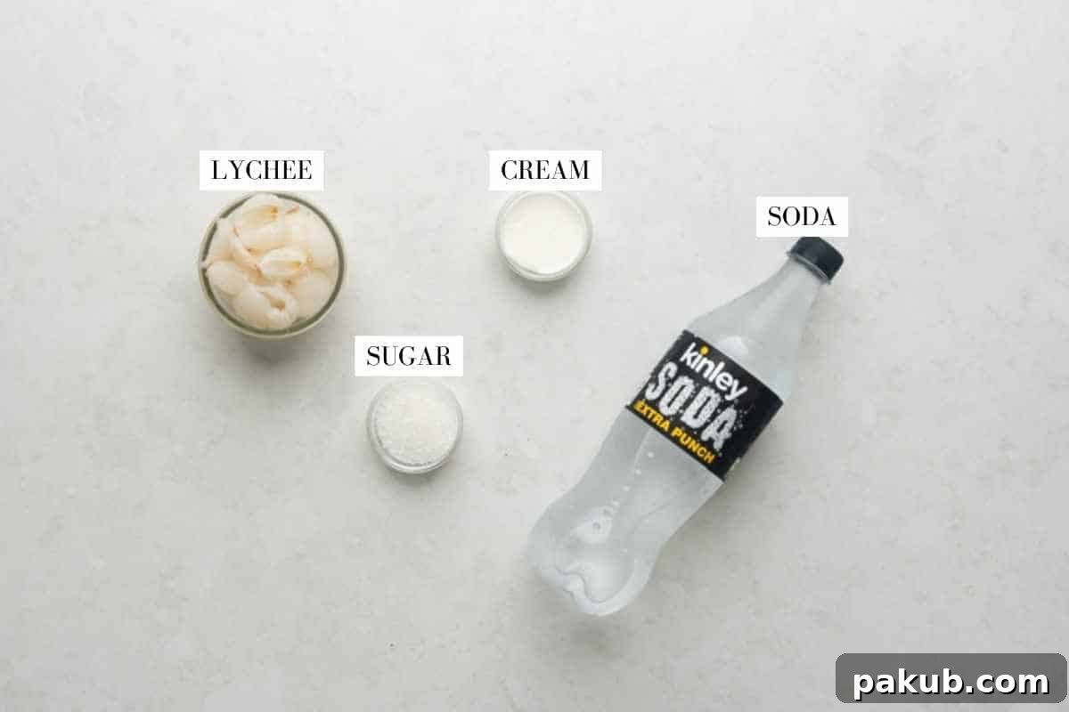 A vibrant flat lay of fresh lychees, a carton of cream, sugar, and sparkling water, showcasing the simple ingredients for Lychee Soda.