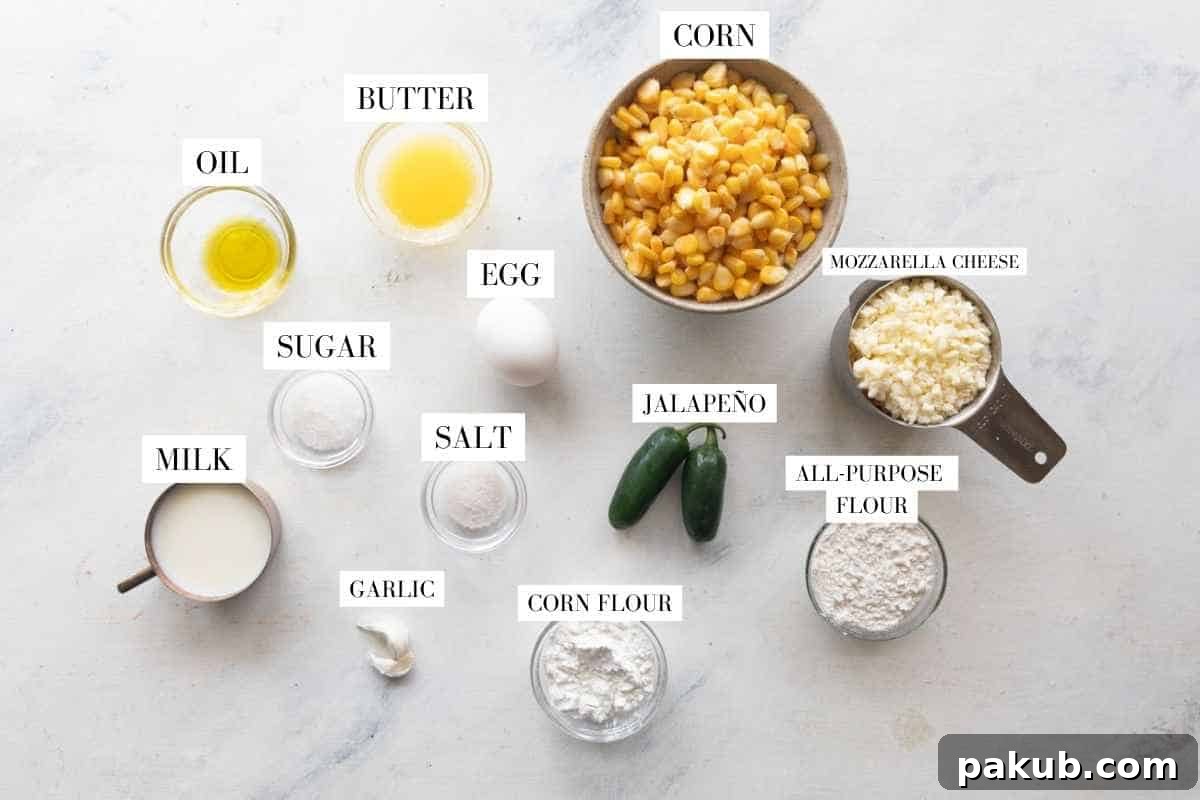 Venezuelan Cachapas Golden Corn Pancakes 3 A neatly arranged flat lay of all the fresh ingredients for making Cachapas, including corn kernels, eggs, milk, flours, garlic, and mozzarella cheese.