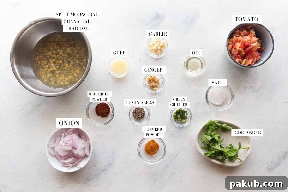 Hearty Dhaba Dal Blend 3 A vibrant flat lay image showcasing all the fresh and dry ingredients required for making Mixed Dhaba Dal, neatly arranged with labels for easy identification.