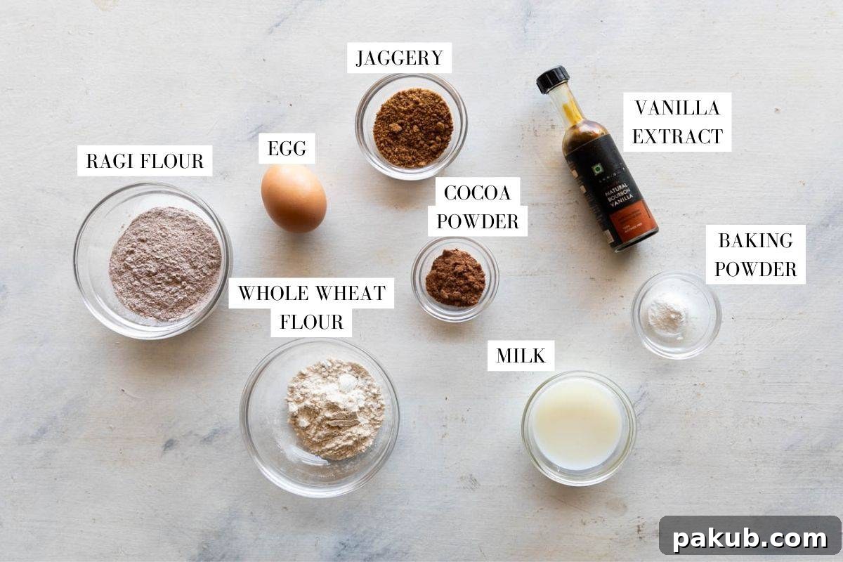 A neatly arranged flat lay of all the essential ingredients required to make delicious Ragi Pancakes, each item clearly identifiable and ready for preparation.
