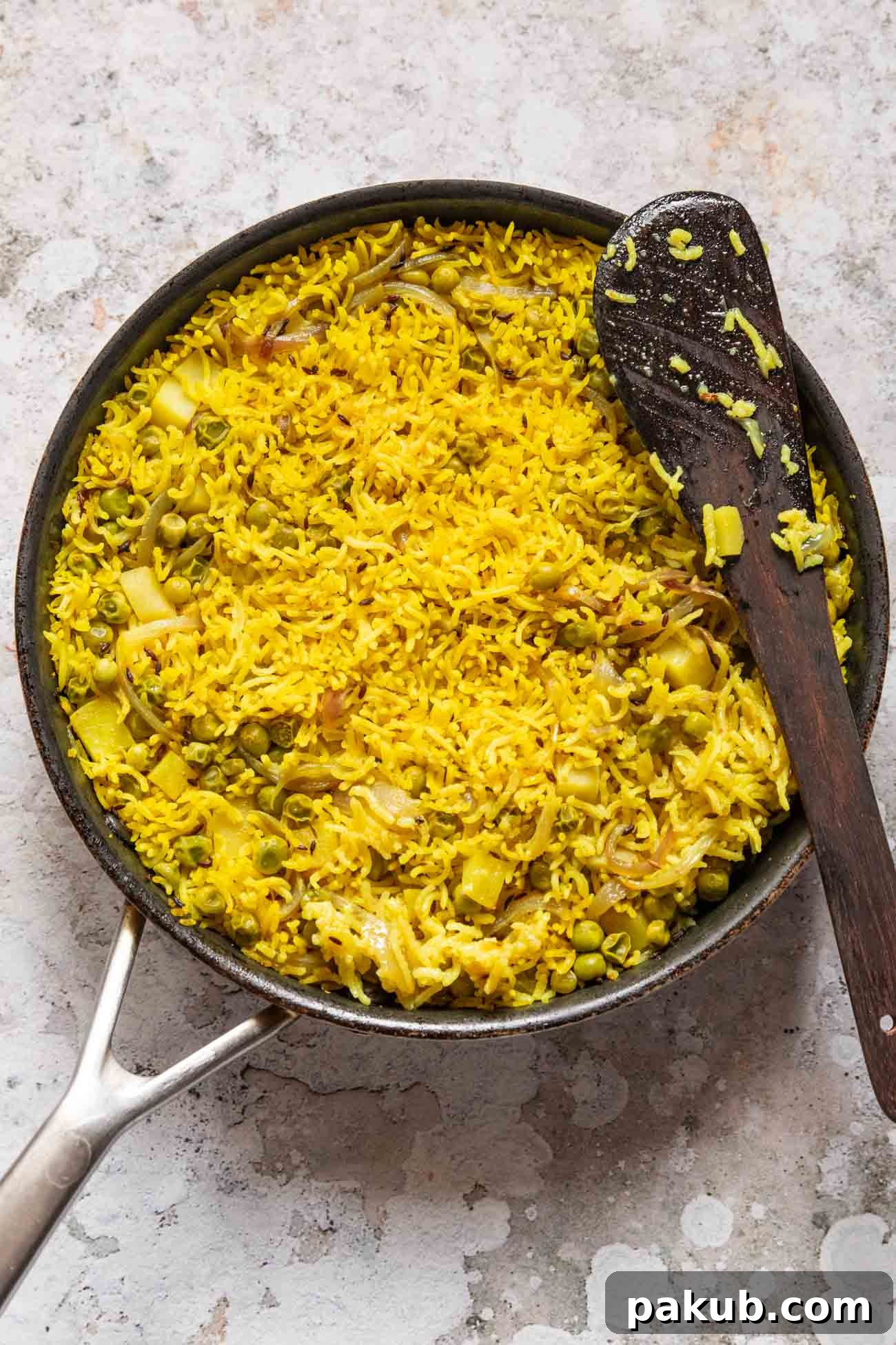 Tahari Tehri Uttar Pradesh's Golden Vegetable Pulao 2 A beautifully presented bowl of freshly made Tahari, garnished with fresh herbs.