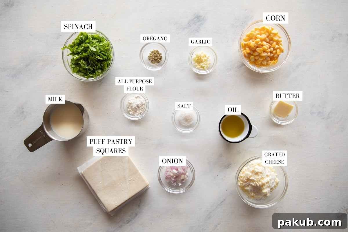 A flat lay photograph displaying all the fresh and packaged ingredients for Corn Spinach Puffs, clearly labeled.