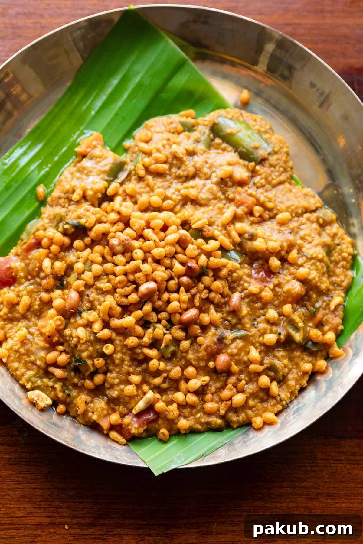 People and Such a Bath 2 Millet bisi bele bath served on a plate lined with banana leaf, showcasing its rich texture and vibrant colors.
