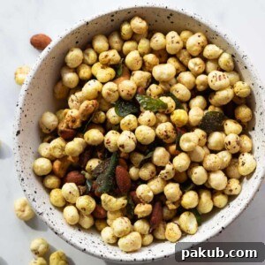 Roasted Makhana and Nuts, a healthy and crunchy snack, served in a pristine white bowl.