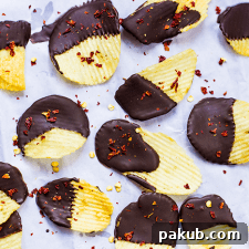 A tantalizing picture of potato chips generously covered in chili chocolate, showcasing their unique sweet and savory appeal.
