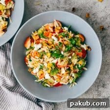 Refreshing cold lemon orzo pasta salad with crumbled feta, neatly arranged in a bowl.