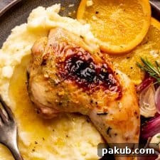 Beautifully roasted spatchcocked chicken leg served over creamy mashed potatoes with a rich jus.