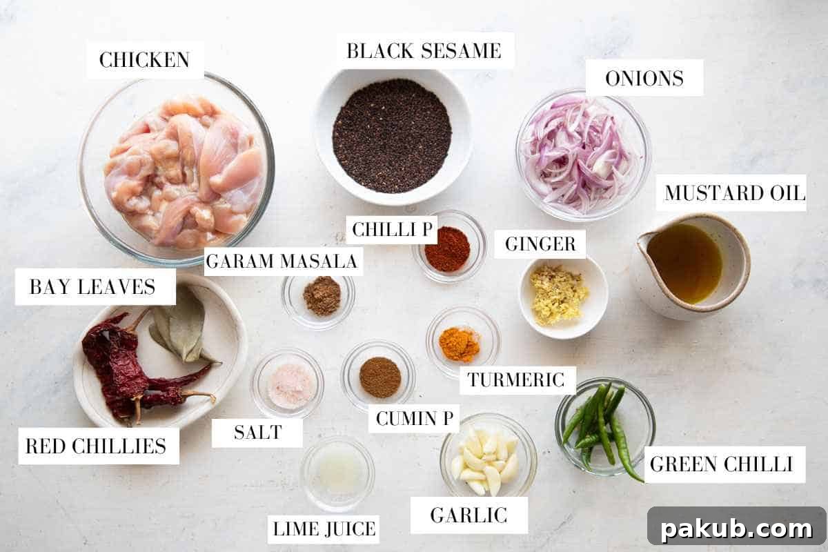 A flat lay photograph showcasing all the fresh ingredients required to make black sesame chicken curry, neatly arranged and labelled.