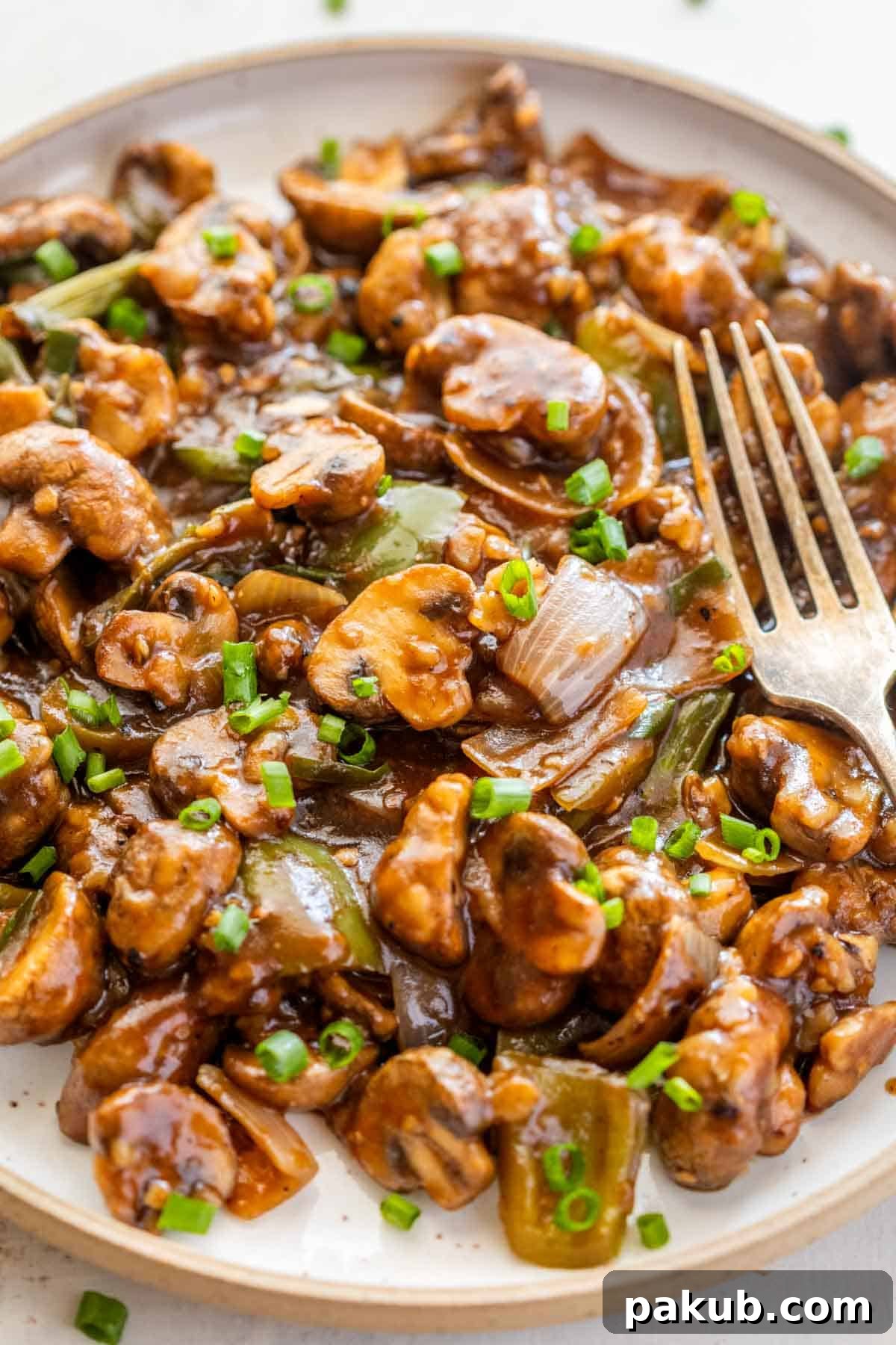 Close-up shot of Air Fryer Mushroom Chilli showcasing the glossy sauce and perfectly cooked mushrooms.