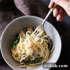 A comforting bowl of Creamy Lemon Mushroom Kale Linguine Pasta, featuring tender pasta, earthy mushrooms, and healthy kale in a rich lemon cream sauce.