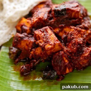 Paneer Ghee Roast served on banana leaf with neer dosa