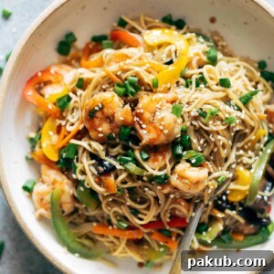 Flavorful Shrimp Chow Mein served in a pristine white bowl, showcasing a hearty and satisfying one-pot meal.