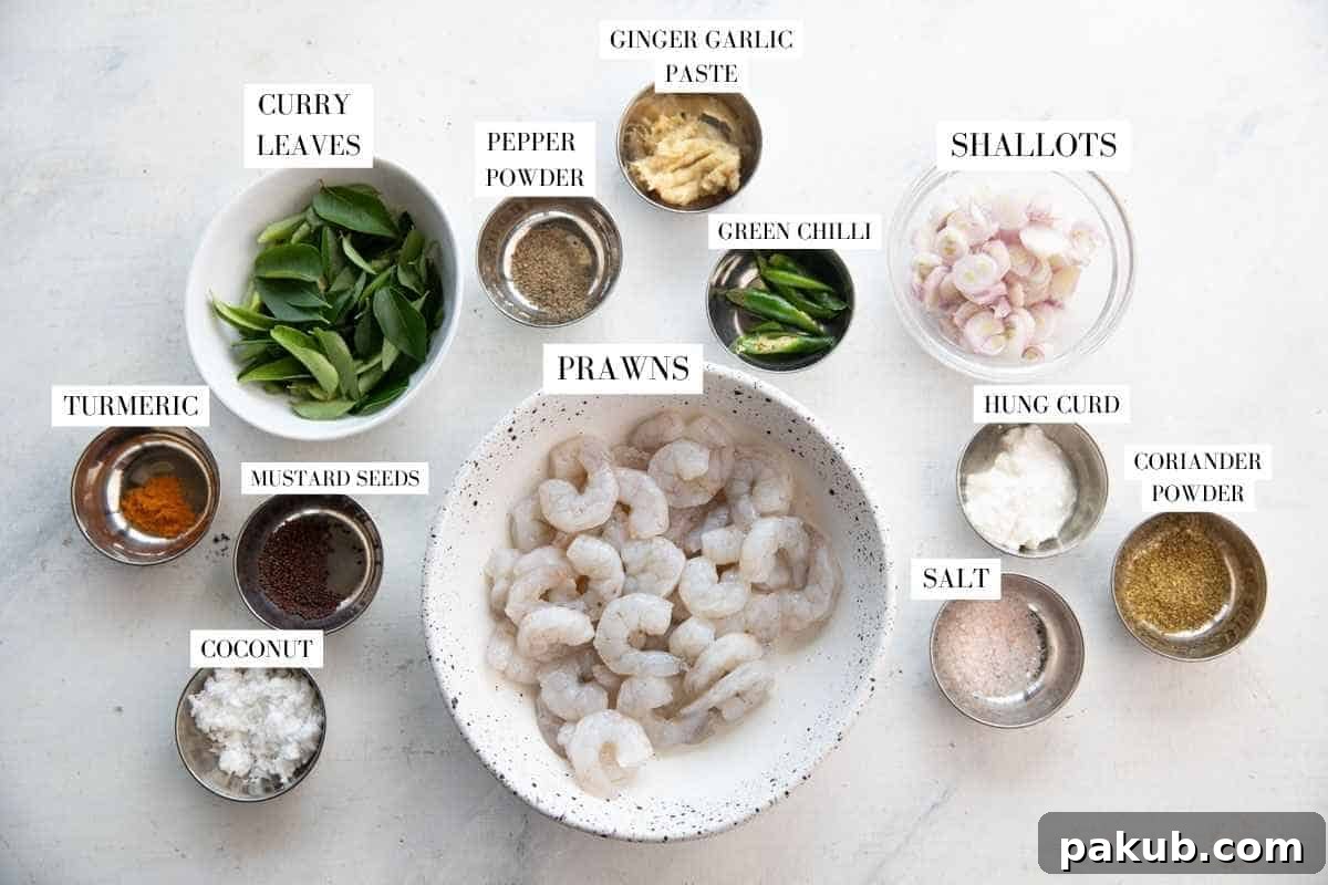 A vibrant display of fresh ingredients including curry leaves, garlic, and coconut, for the curry leaf prawns