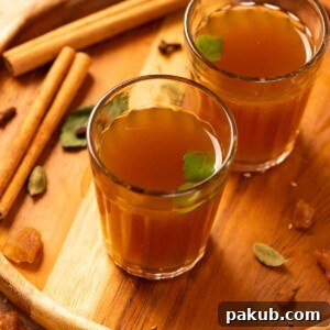 kadha garnished with fresh tulsi leaves