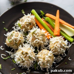 chicken porcupine meatballs served with a salad and a dipping sauce