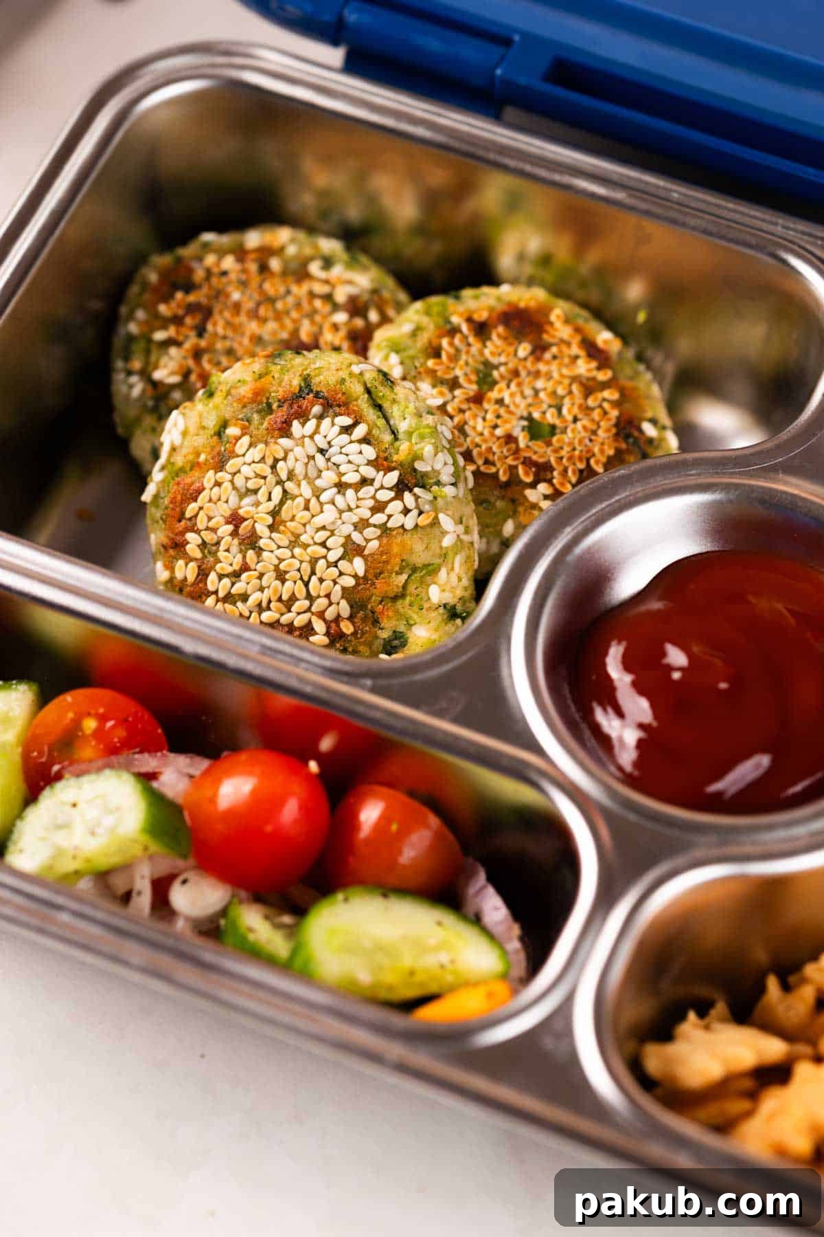 Broccoli corn tikkis neatly packed in a tiffin box, ready for a healthy and satisfying meal on the go.
